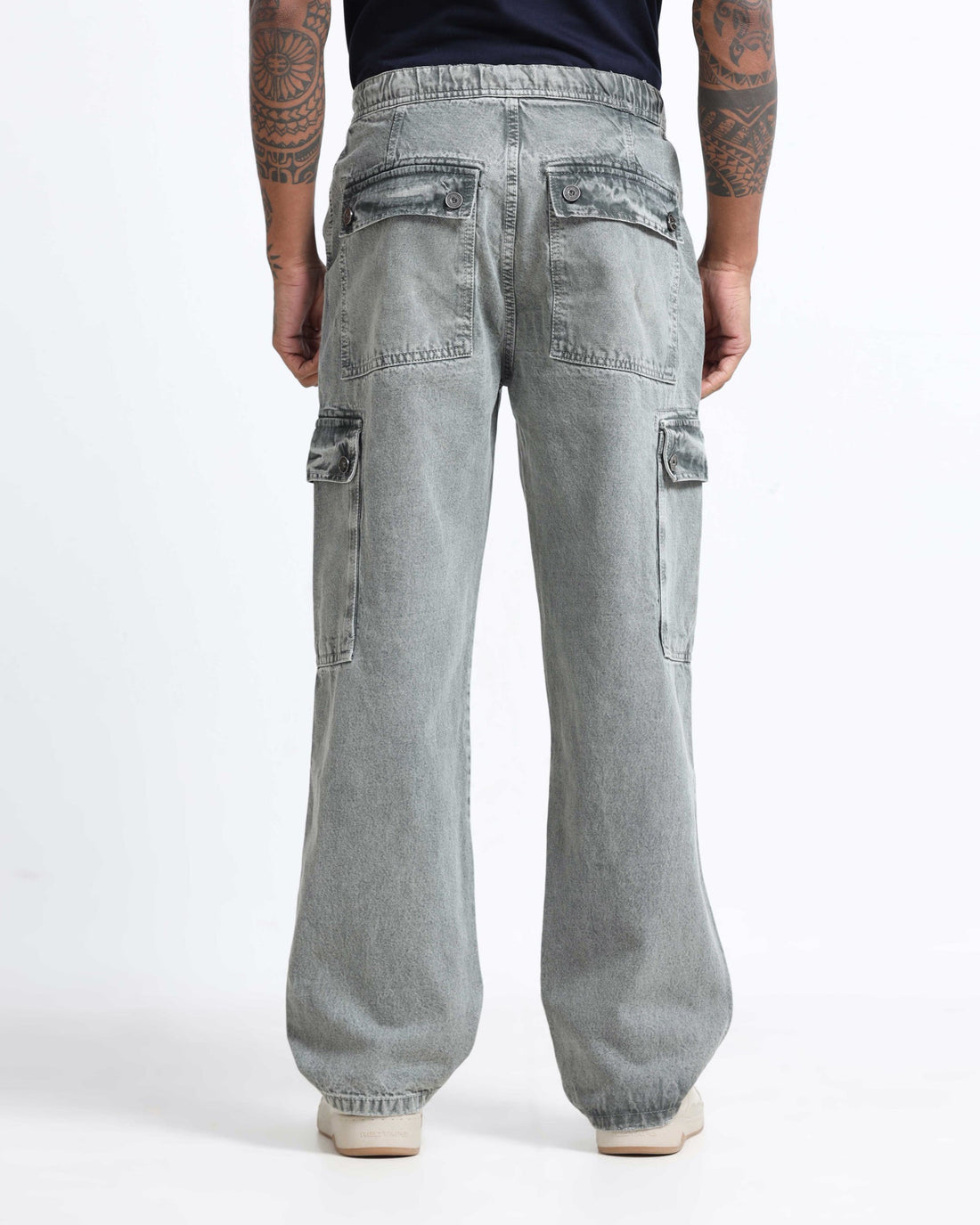 Men comparing denim jeans and cargo pants from Rockstar Jeans collection for comfort and styling decision