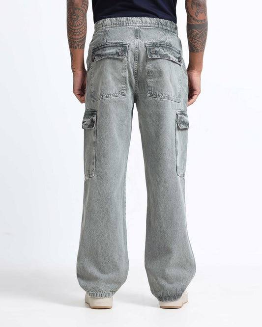 Men comparing denim jeans and cargo pants from Rockstar Jeans collection for comfort and styling decision