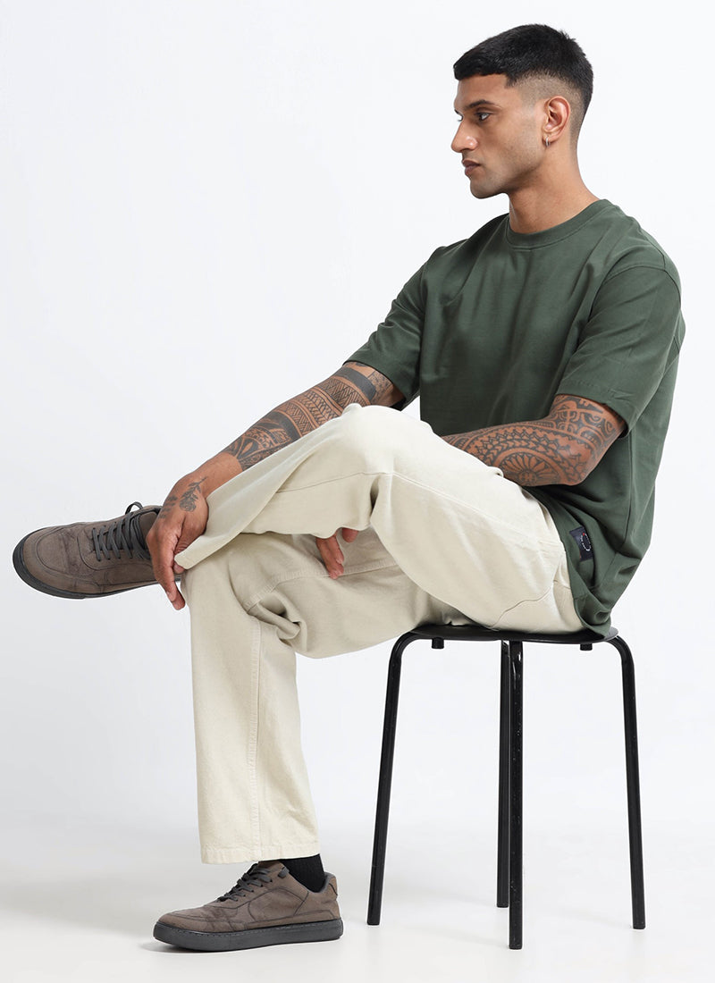 SIGNATURE Oversized Solid Cotton T-Shirt Forest Green - Model Sitting Poss