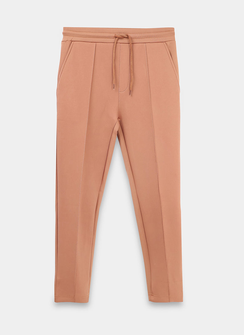 SUPER STRETCH Relaxed Fit Elastic Waistband With Drawstring Trousers Desert Sand-Flatlay Front iew