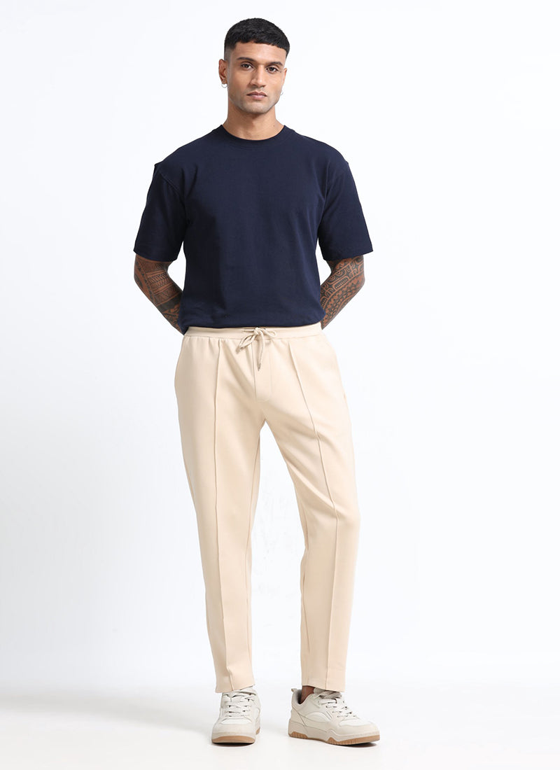 SUPER STRETCH Relaxed Fit Elastic Waistband With Drawstring Trousers Ecru Ivory-Model Front View