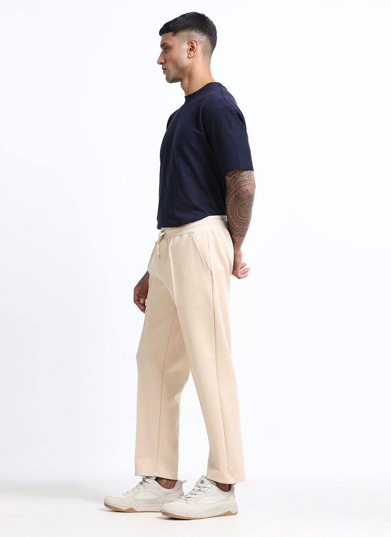 SUPER STRETCH Relaxed Fit Elastic Waistband With Drawstring Trousers Ecru Ivory-Model Side View